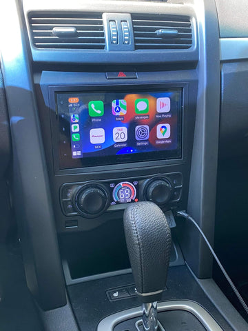 Picture shows the Aerpro kit installed with a double din radio. The factory pocket with USB power outlet is shown here, this cannot be retained in models with the flip down tray as found on the VXR8 and Holden Clubsport. The coin tray or wireless phone charger will need to be installed in its place for a no gap finish fitment.